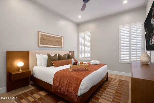 a bedroom with bed and window