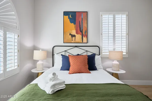 a bedroom with a bed and window
