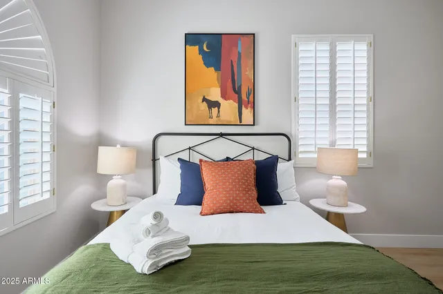 a bedroom with a bed and window