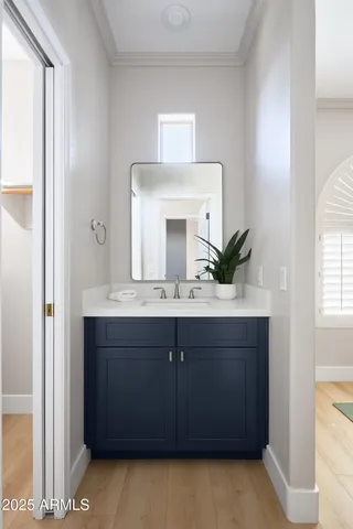 a bathroom with a granite countertop sink a mirror and a