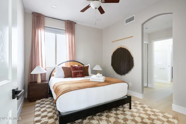 a bedroom with bed and window