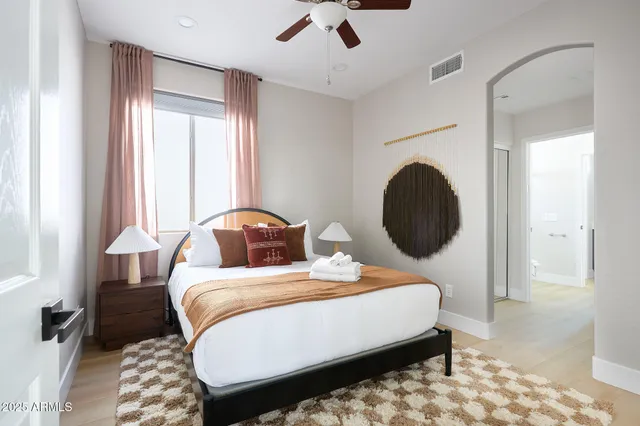 a bedroom with bed and window