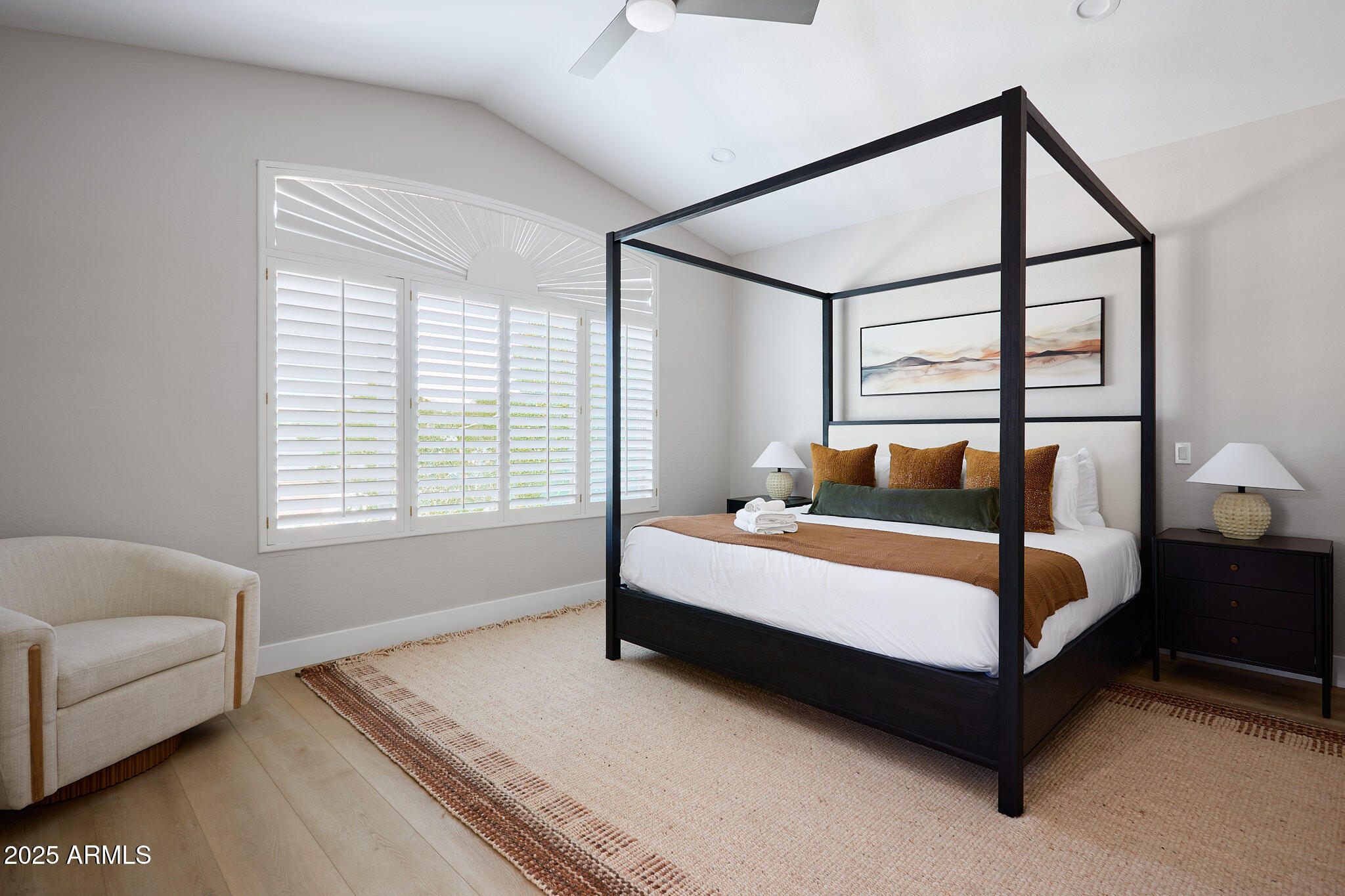 3202 East Orange Drive Phoenix, AZ 85018 - Photo 28 of 52 a bed sitting in a bedroom next to a window