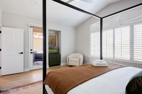 a bedroom with a bed and window