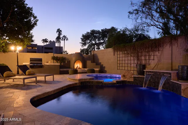 a view of a swimming pool with sitting area