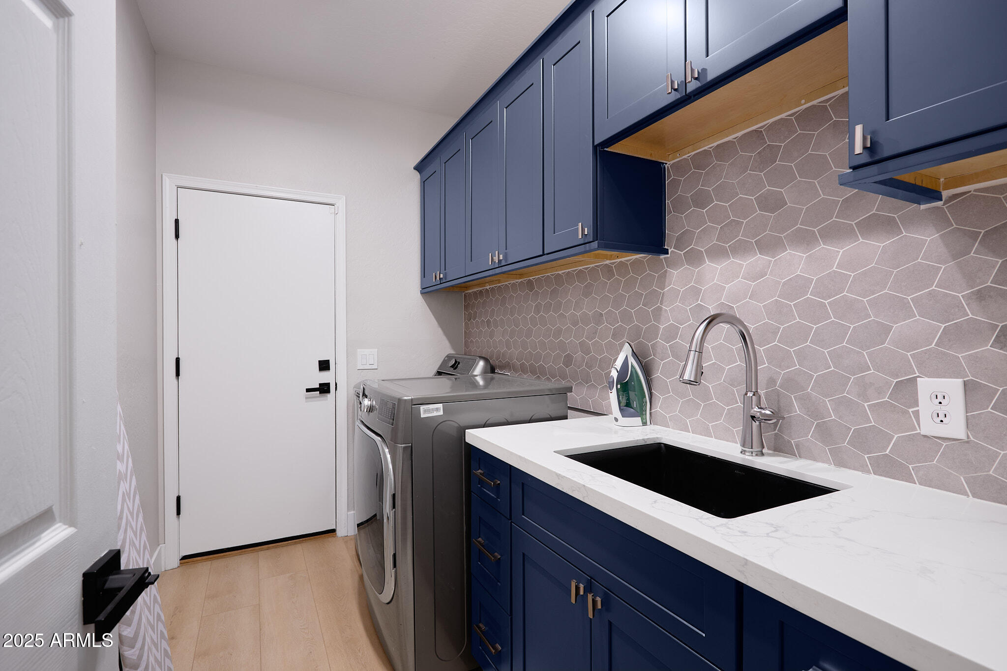 3202 East Orange Drive Phoenix, AZ 85018 - Photo 35 of 52 a kitchen with a sink a stove and cabinets
