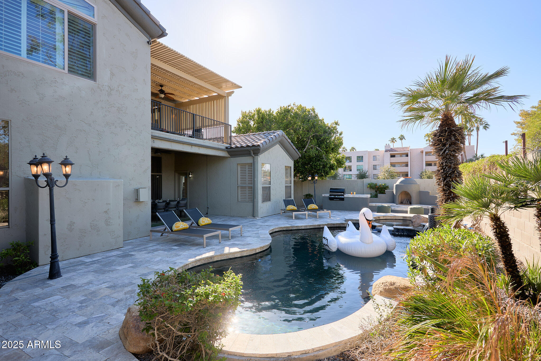 3202 East Orange Drive Phoenix, AZ 85018 - Photo 36 of 52 a view of a house with backyard water fountain and sitting area