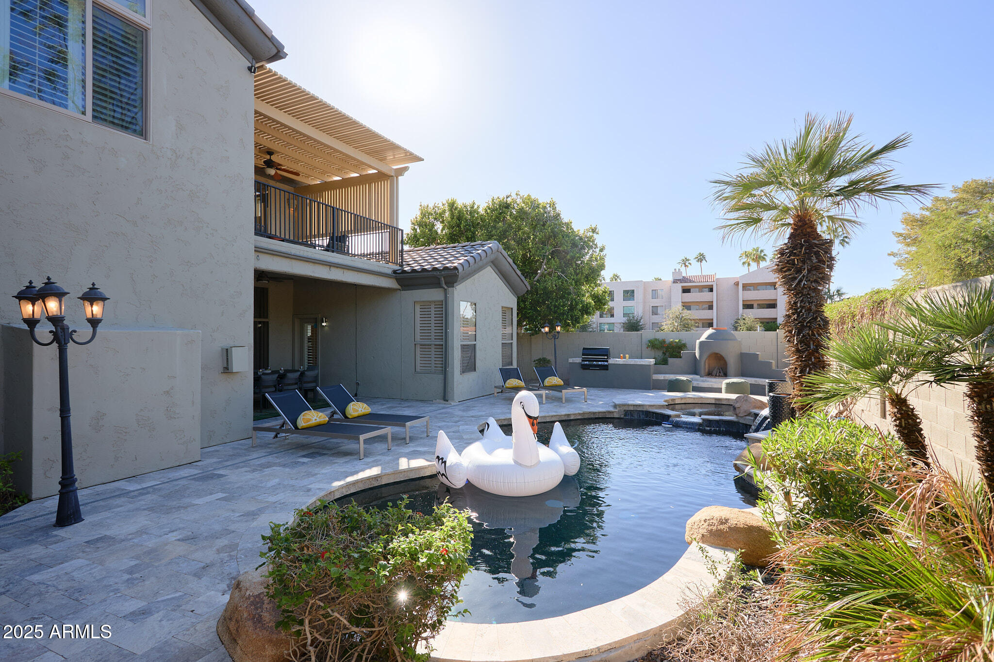3202 East Orange Drive Phoenix, AZ 85018 - Photo 37 of 52 a view of a patio with table and chairs potted plants