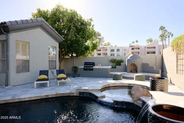 a view of a house with pool table and chairs