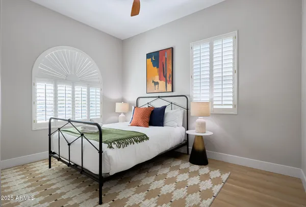 a bedroom with a bed and window