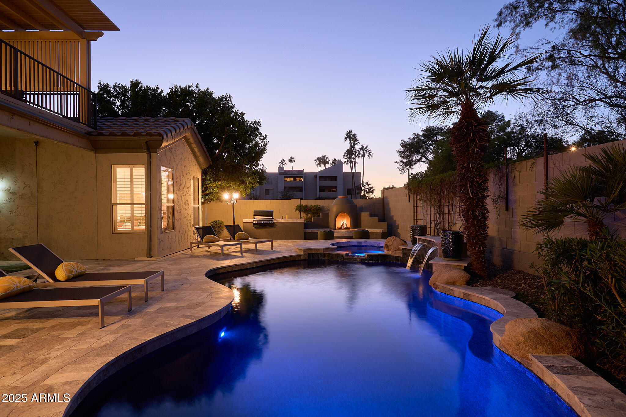 3202 East Orange Drive Phoenix, AZ 85018 - Photo 51 of 52 a view of a swimming pool with outdoor seating and a terrace