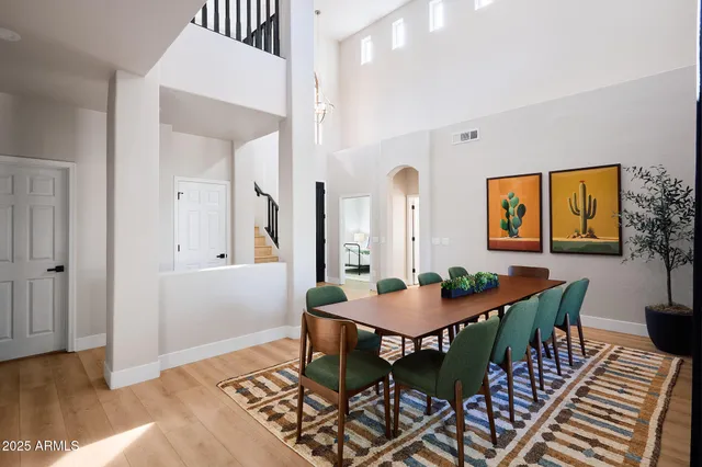 a dining room with furniture and wooden floor
