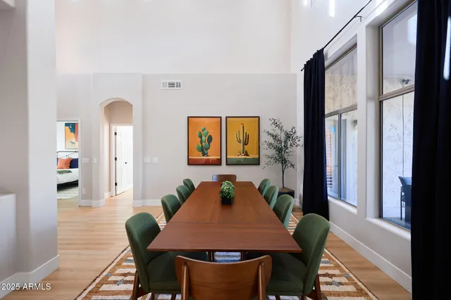 a view of a dining room with furniture window and wooden floor