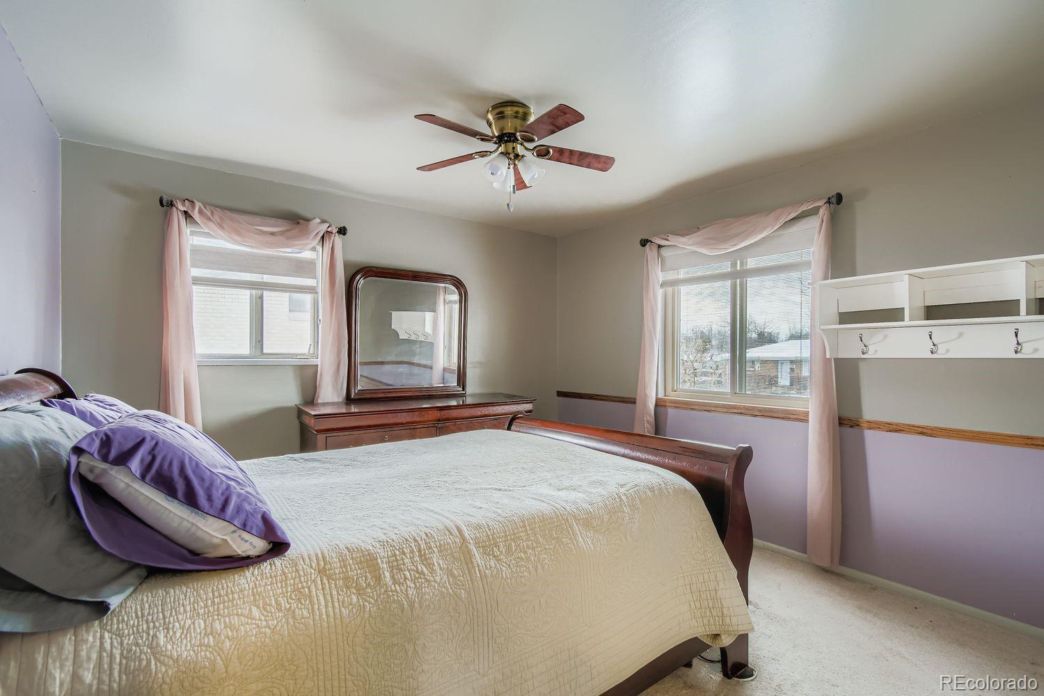 8510 Faraday Street Denver, CO 80229 - Photo 12 of 25 a bedroom with a bed and window