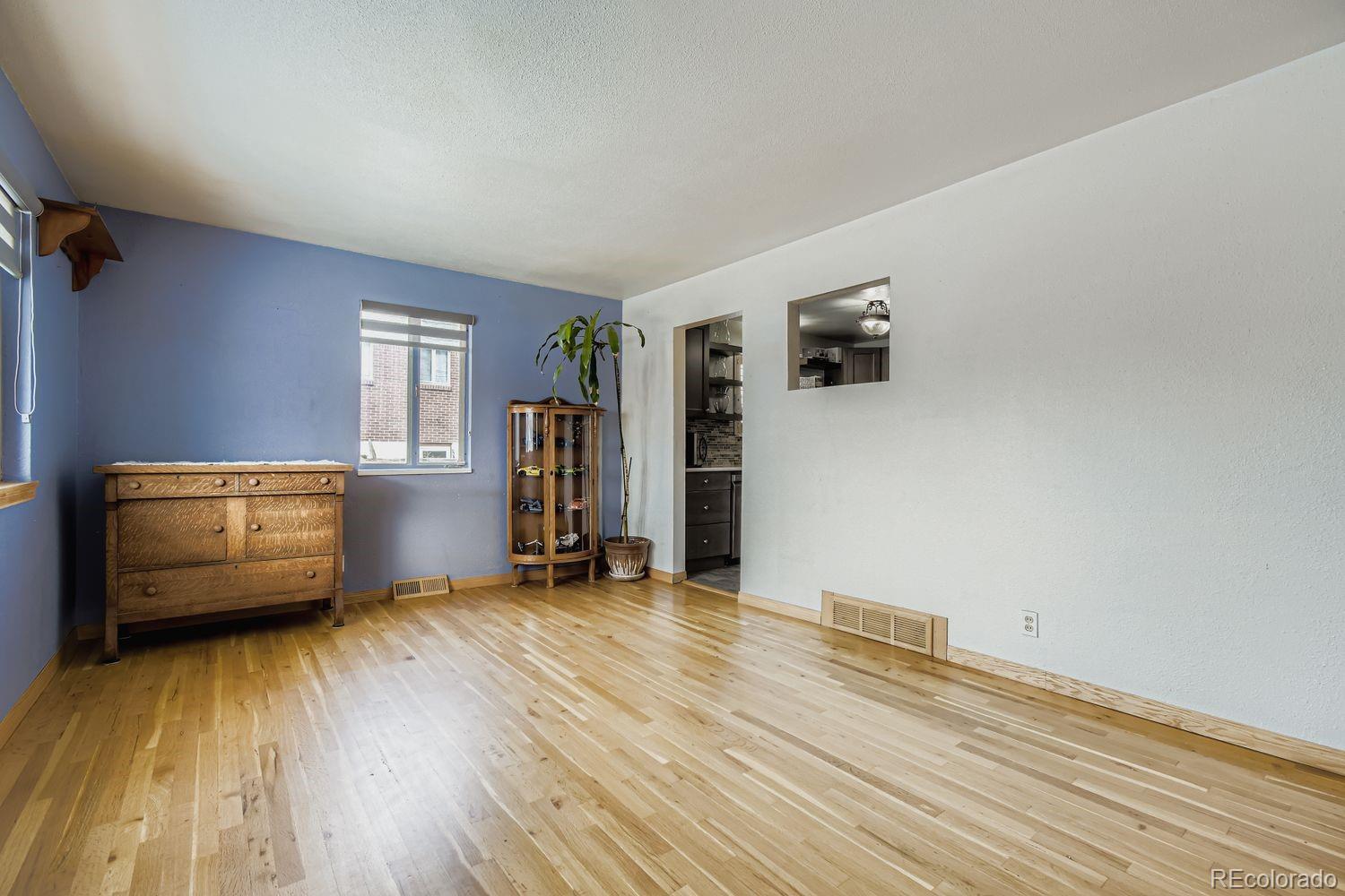 8510 Faraday Street Denver, CO 80229 - Photo 8 of 25 wooden floor and windows in a room
