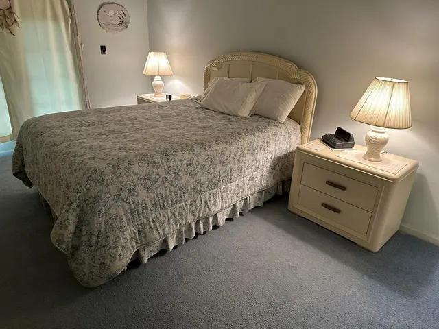 a bed room with a bed and a lamp