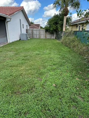 a view of a backyard with a plants