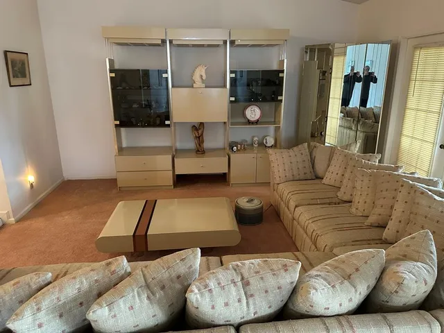 a living room with furniture and a couch