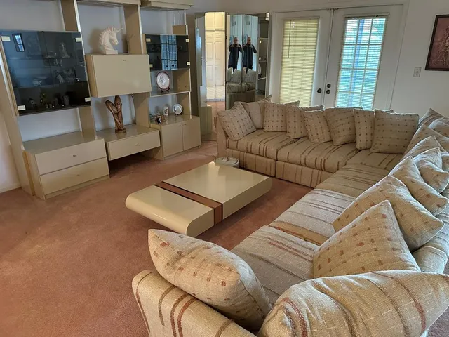 a living room with furniture and a couch