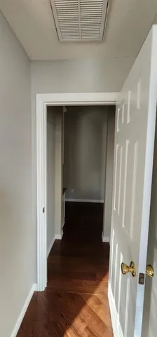 a large kitchen with granite countertop a stove a sink and a microwave