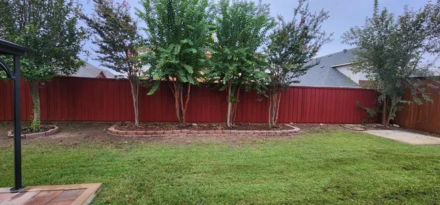 a backyard of a house with lots of green space