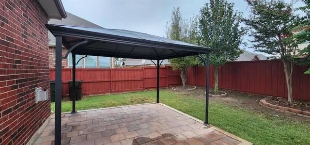 a view of a backyard with plants