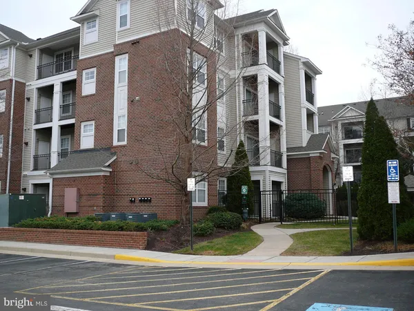 a view of a building with a yard