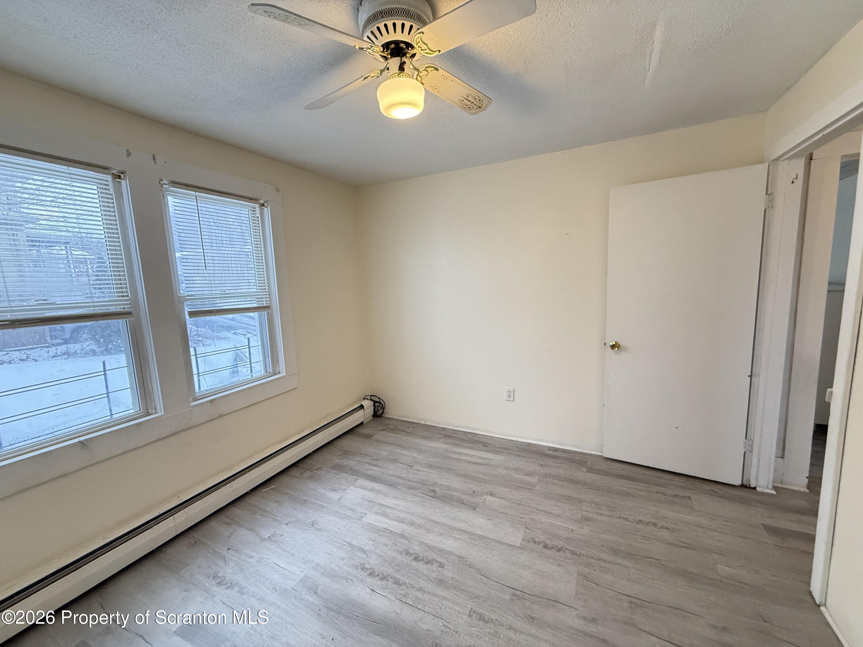 2140 Pond Avenue Scranton, PA 18508 - Photo 12 of 16 wooden floor in an empty room with a window