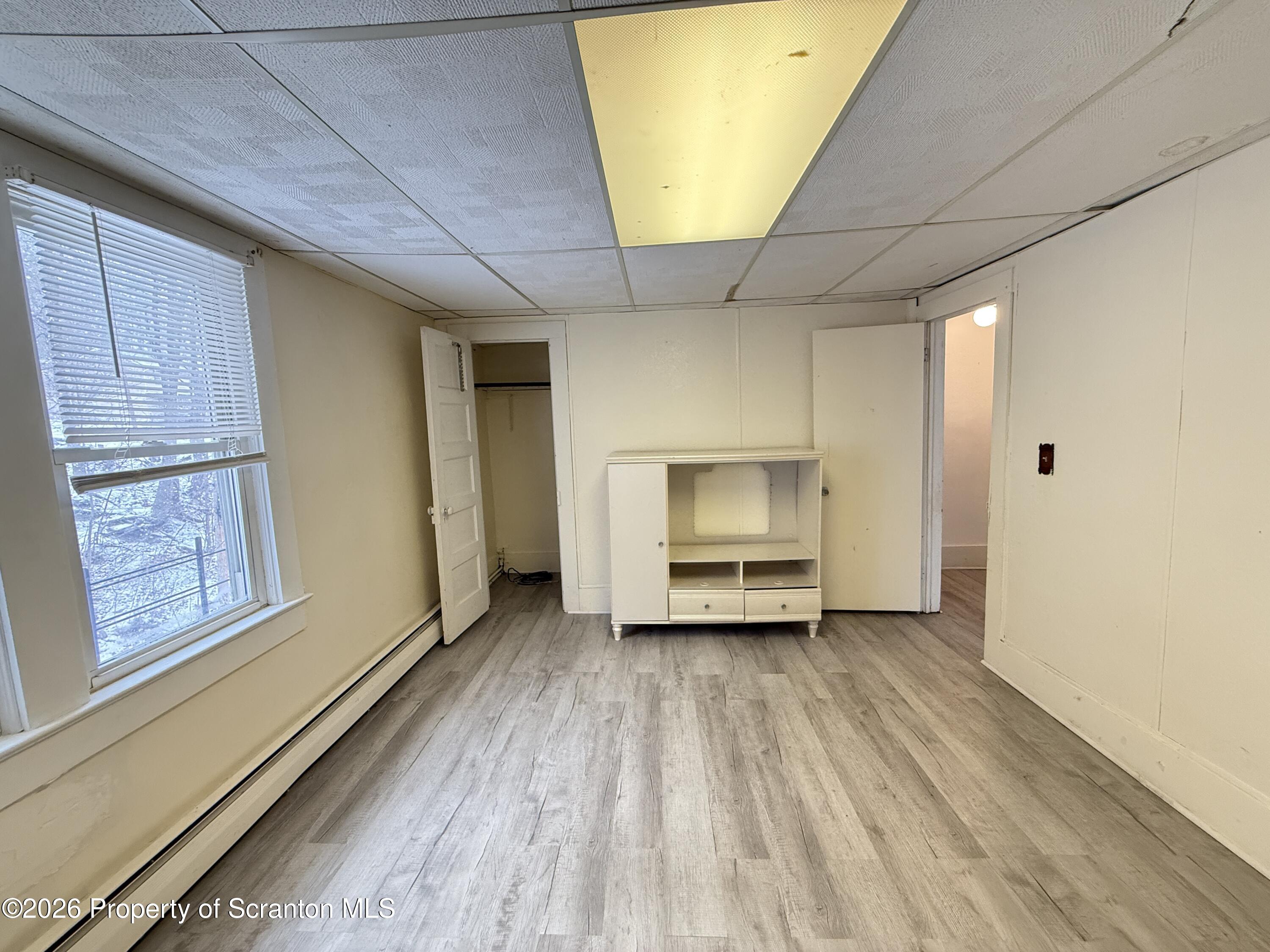 2140 Pond Avenue Scranton, PA 18508 - Photo 14 of 16 a view of an empty room with a window and wooden floor