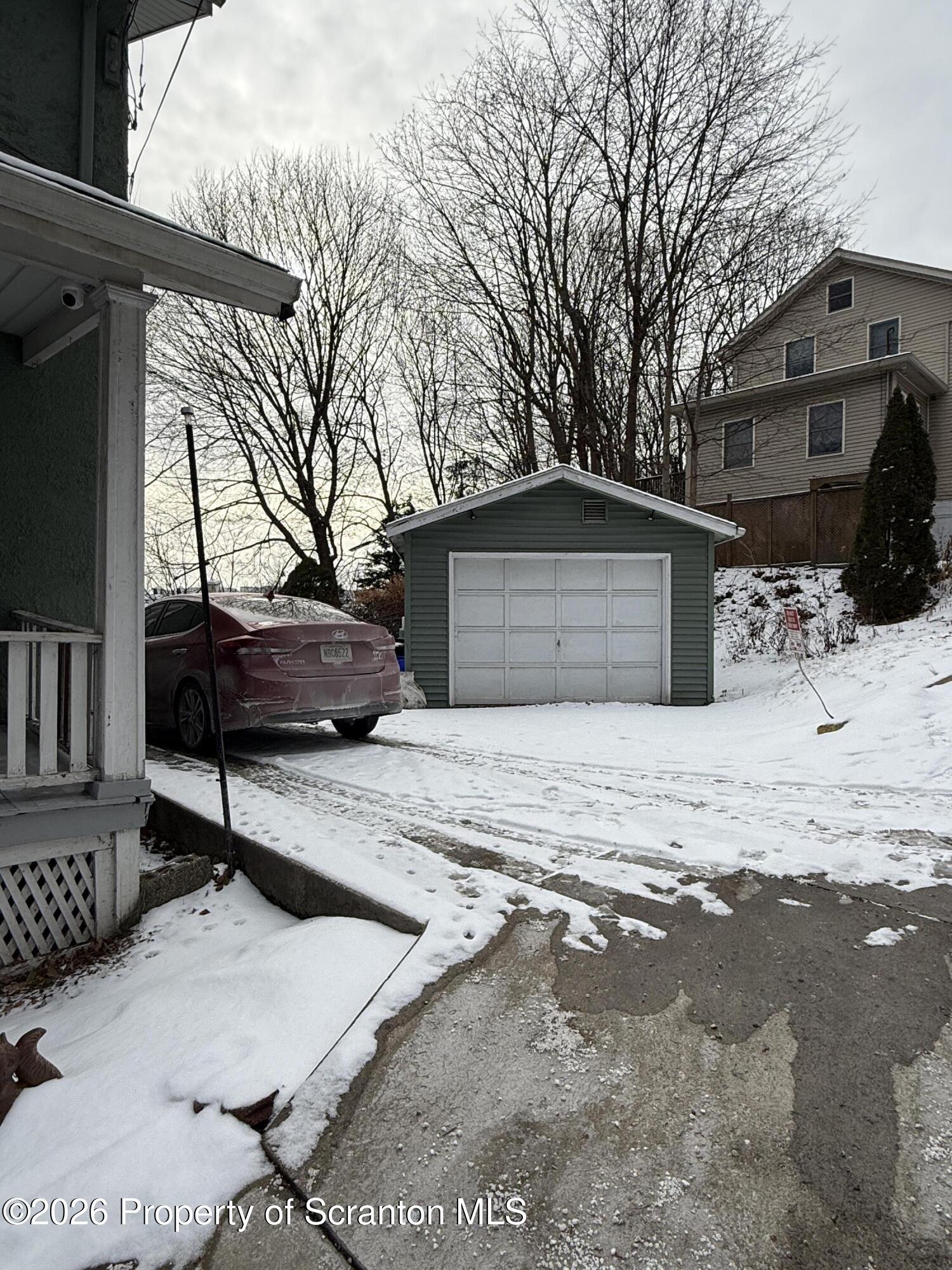 2140 Pond Avenue Scranton, PA 18508 - Photo 2 of 16 a view of a house with a snow on the road