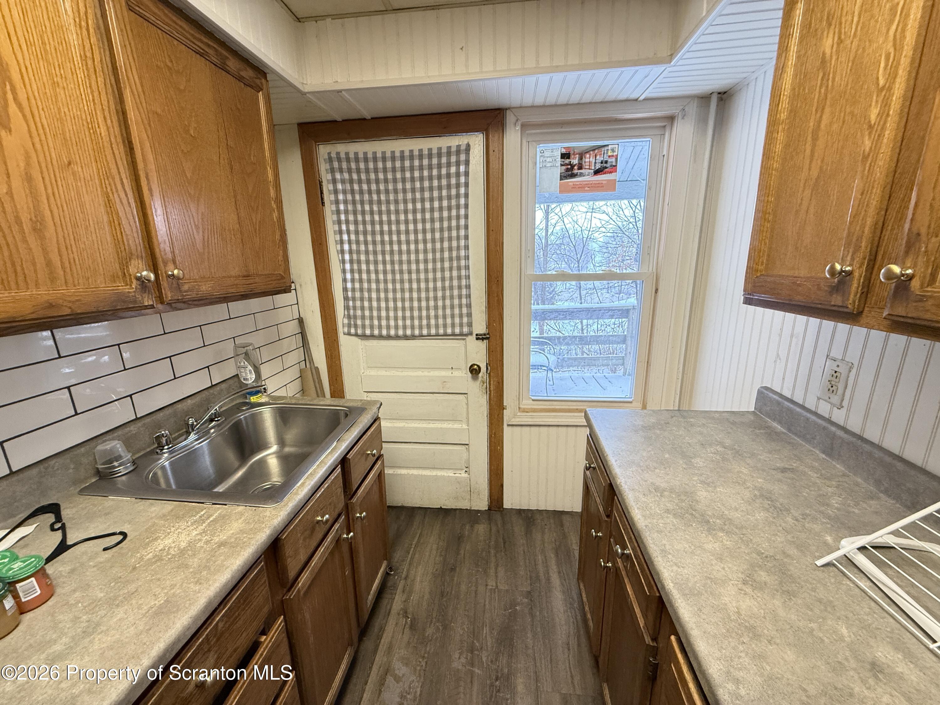 2140 Pond Avenue Scranton, PA 18508 - Photo 10 of 16 a kitchen with a sink stove and cabinets