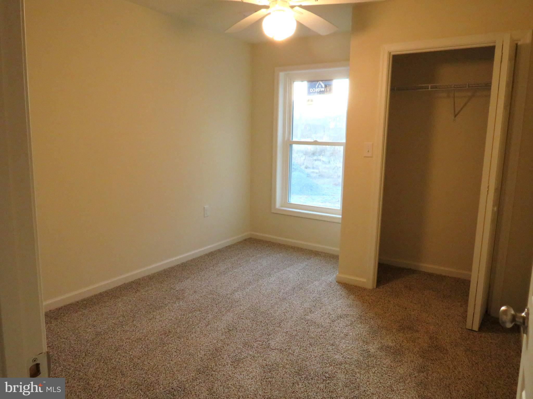 26350 East Pear Street Crisfield, MD 21817 - Photo 12 of 22 an empty room with windows and closet