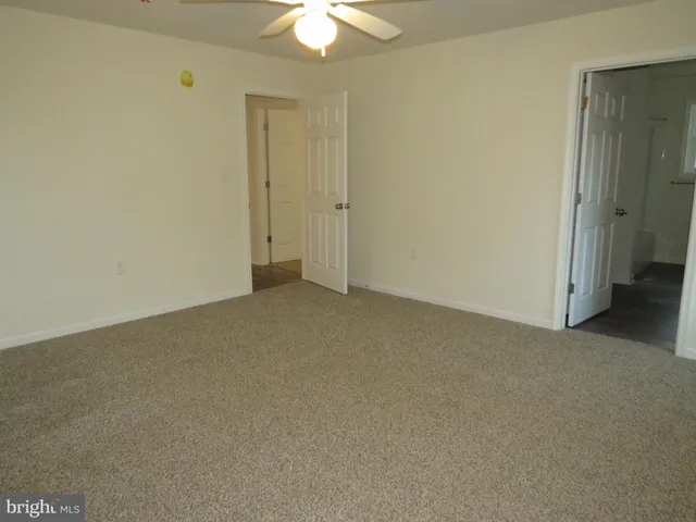 an empty room with a bathroom