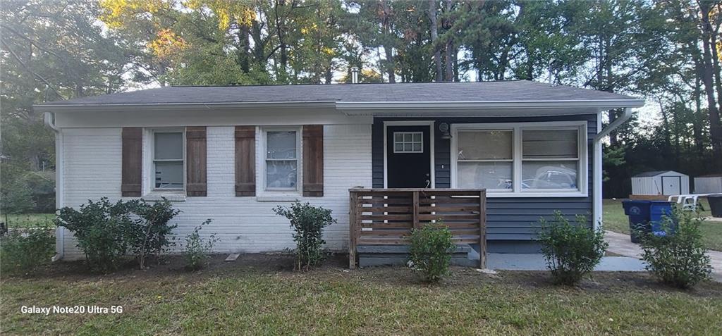 1009 Fairburn Road Northwest Atlanta, GA 30331 - Photo 1 of 15 front view of a house with a yard