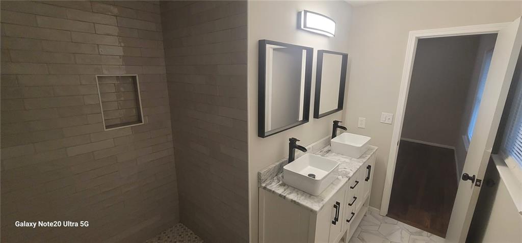 1009 Fairburn Road Northwest Atlanta, GA 30331 - Photo 11 of 15 a bathroom with a sink toilet and mirror