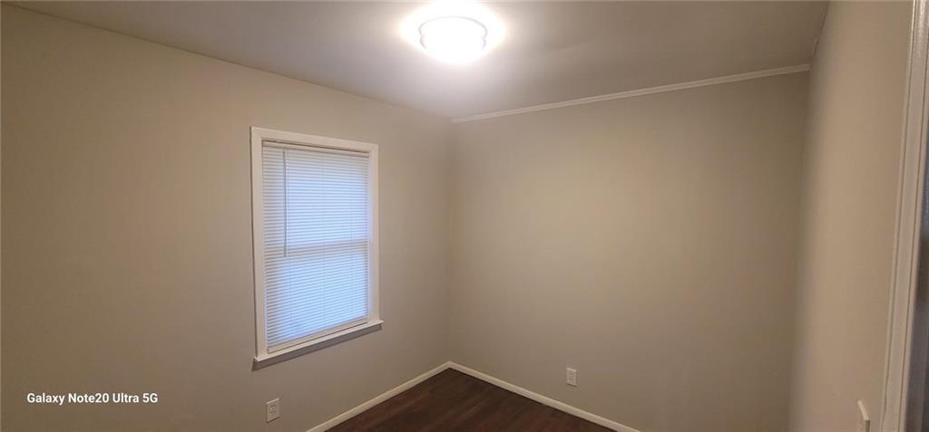 1009 Fairburn Road Northwest Atlanta, GA 30331 - Photo 12 of 15 a view of small space with wooden floor and windows
