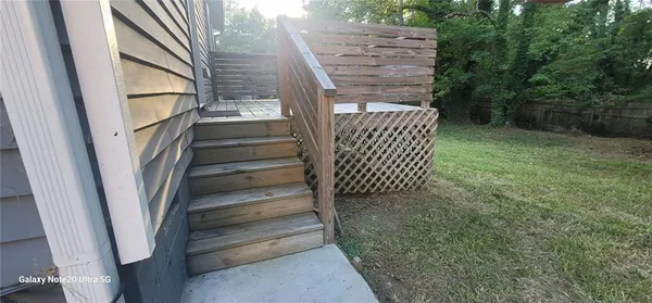 a view of balcony with wooden floor