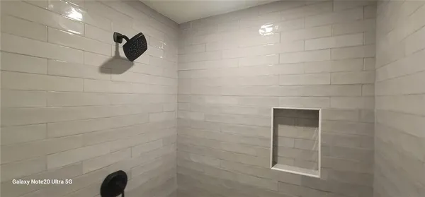 a bathroom with a sink toilet and mirror
