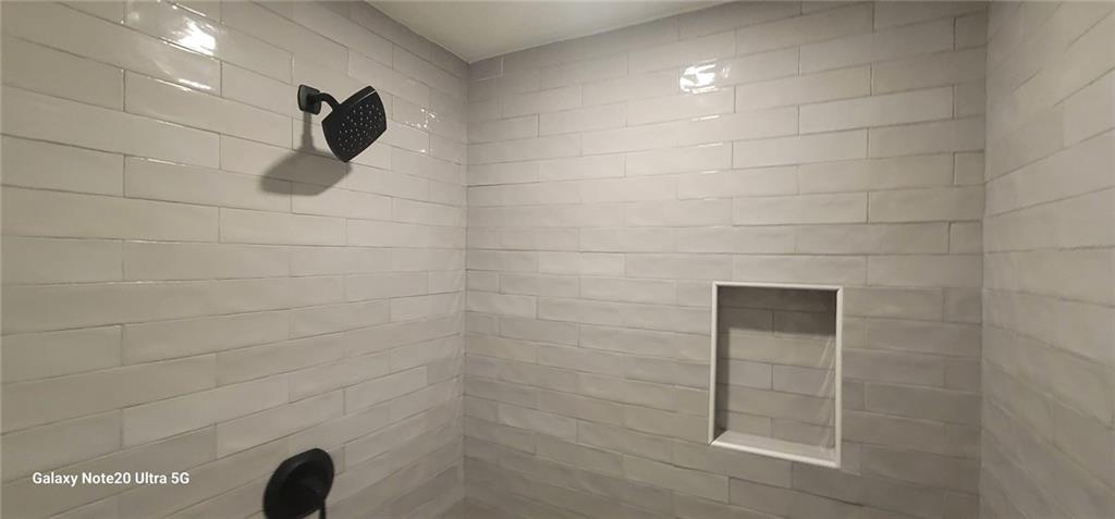 1009 Fairburn Road Northwest Atlanta, GA 30331 - Photo 10 of 15 a bathroom with a shower