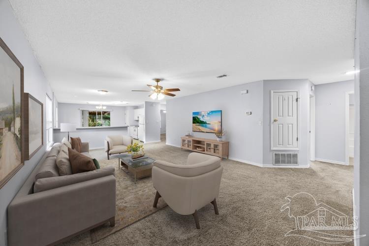 1009 Simpson Street Pensacola, FL 32526 - Photo 1 of 18 a living room with furniture and a flat screen tv