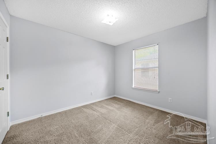 1009 Simpson Street Pensacola, FL 32526 - Photo 16 of 18 an empty room with a window