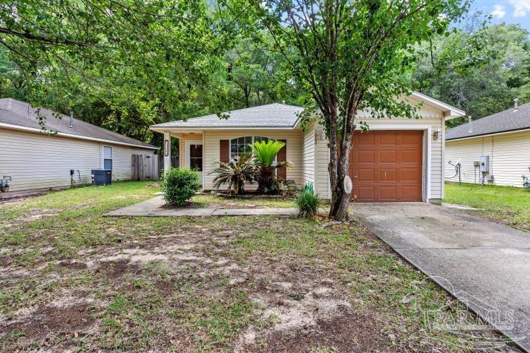 1009 Simpson Street Pensacola, FL 32526 - Photo 18 of 18 a front view of a house with garden