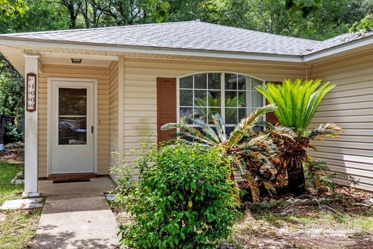 1009 Simpson Street Pensacola, FL 32526 - Photo 2 of 18 a front view of a house with a yard