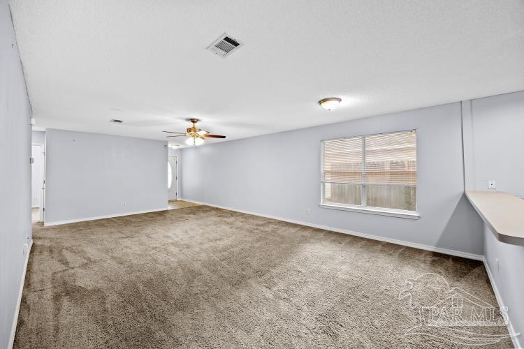 1009 Simpson Street Pensacola, FL 32526 - Photo 4 of 18 a view of an empty room with a window