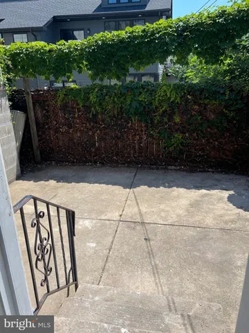 a kitchen with stainless steel appliances wooden floors and wooden cabinets