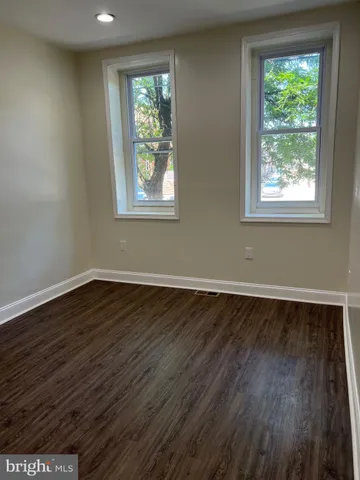 a bathroom with a sink a mirror and vanity