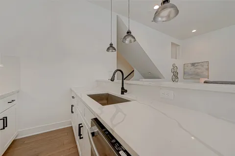 a kitchen with a sink and cabinets