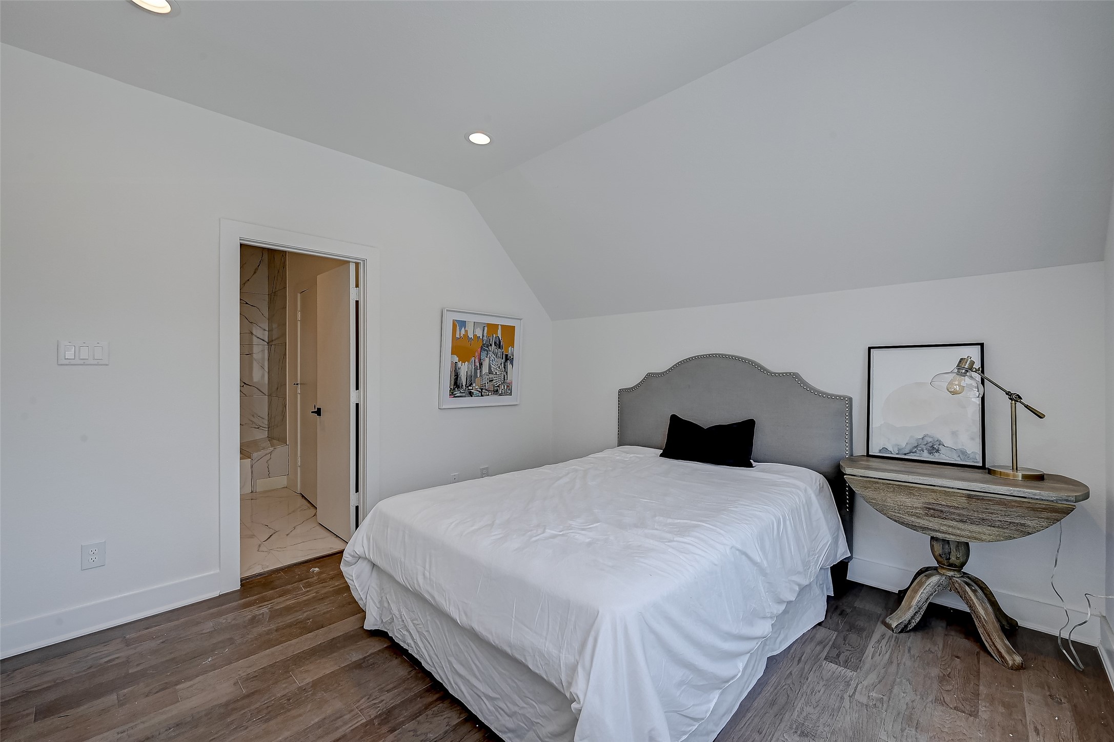 6030 Beall Street Houston, TX 77091 - Photo 17 of 18 a bedroom with a bed and a table in it