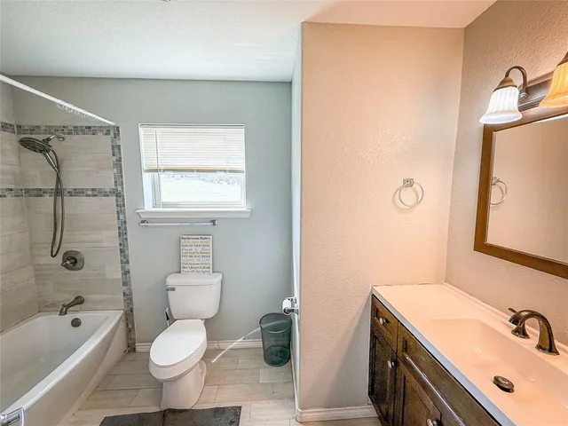 a bathroom with a sink toilet a shower and bathtub