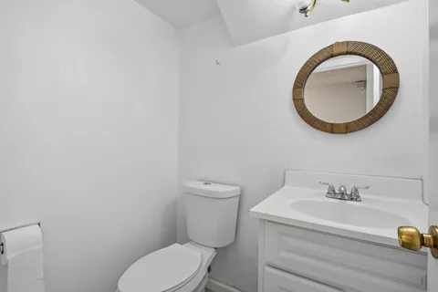 a bathroom with a toilet and a sink